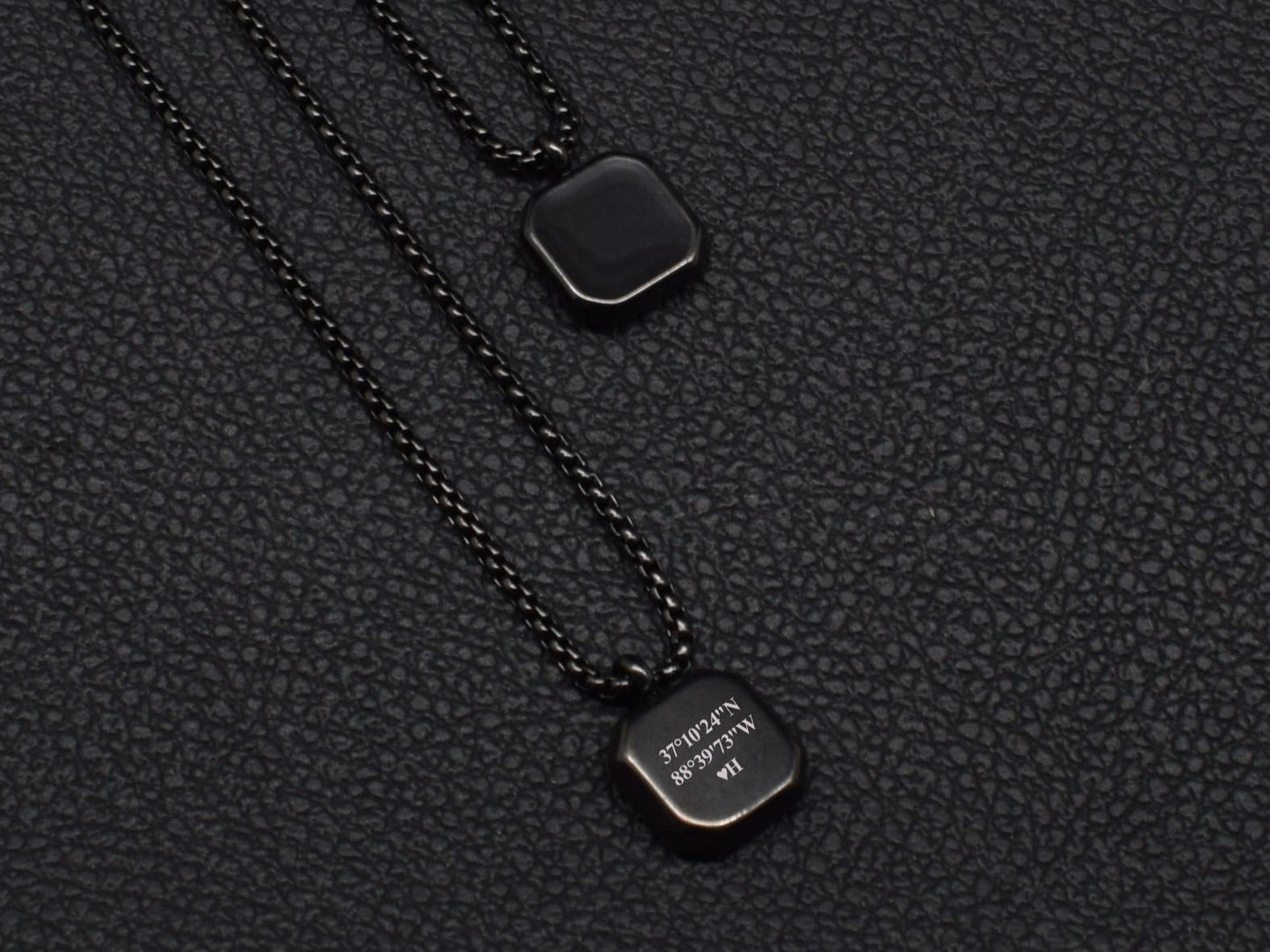 Personalized black pendant necklace with initials and coordinates