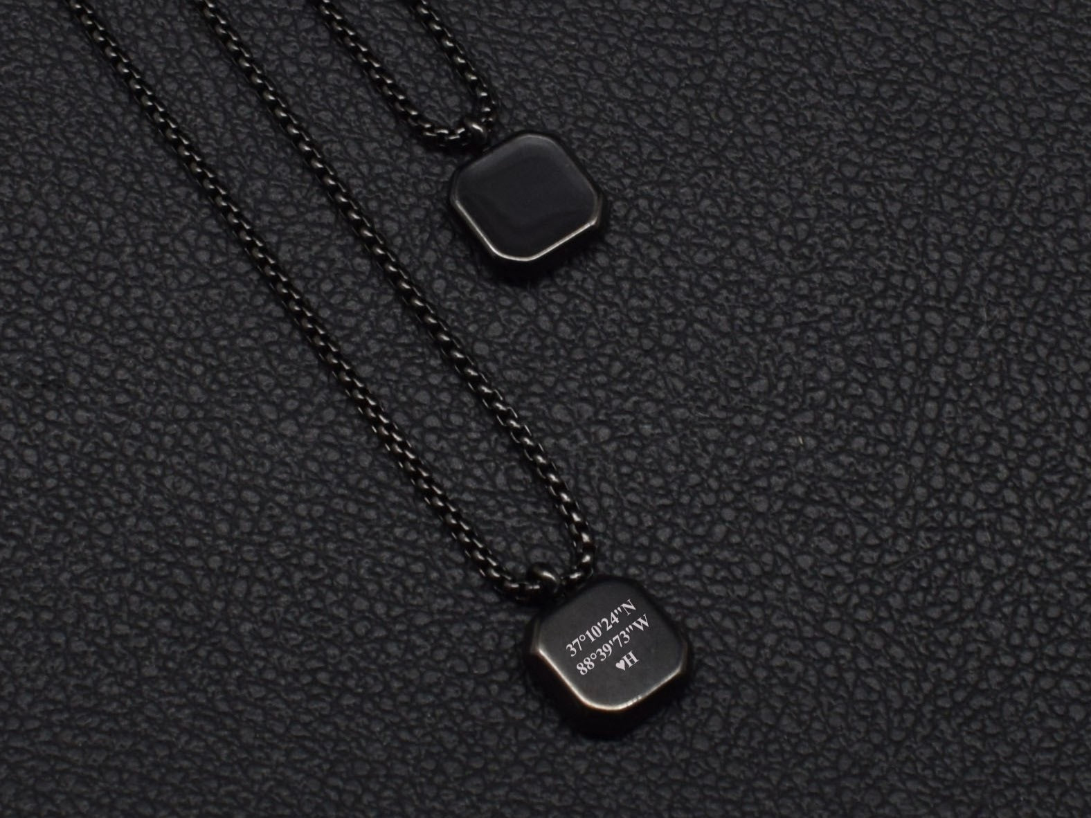 Personalized black pendant necklace with initials and coordinates