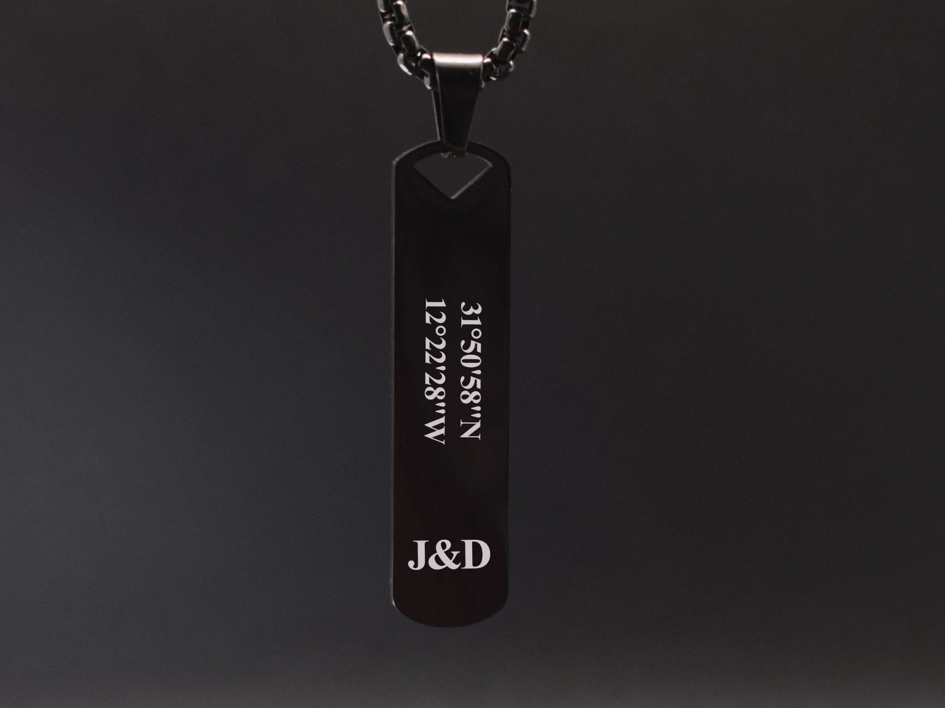 Black pendant necklace with engraved custom coordinate and initials